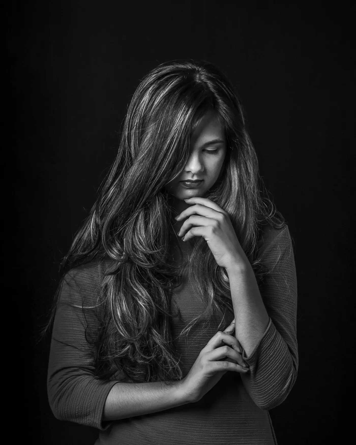 Black and white portrait of a woman with long dark hair