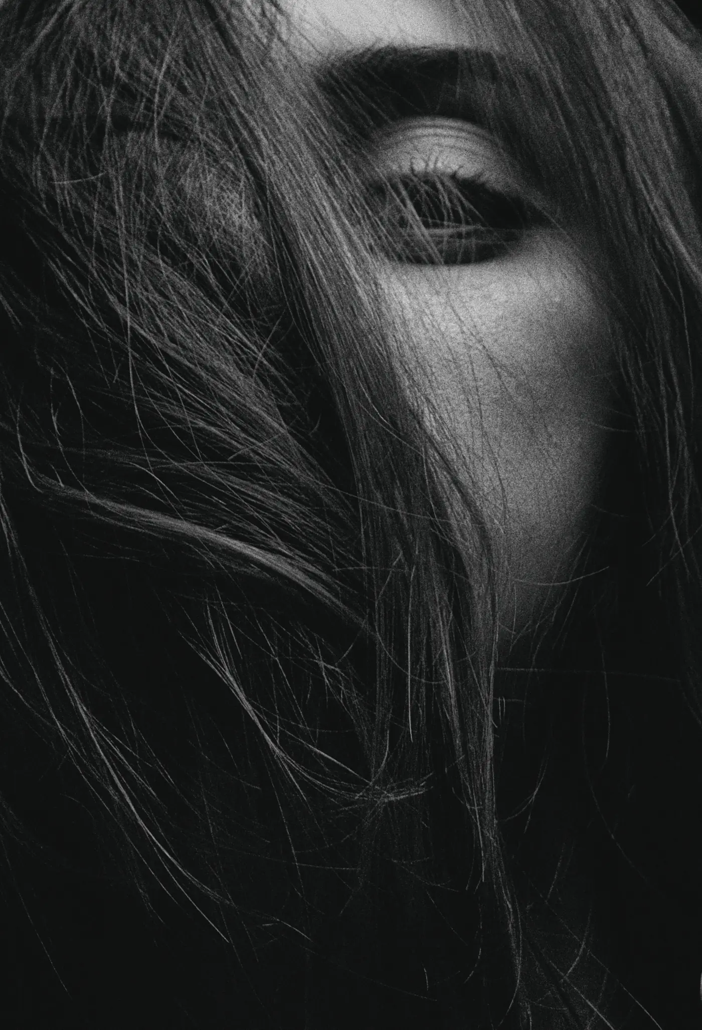 Black and white image of long, layered dark hair